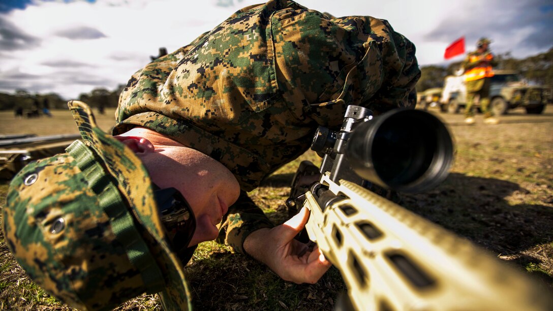 Sergeant Tanner Grace, a native of Troy, Pennsylvania, and an armorer for the Marine Corps Shooting Team, works on the next-generation M40 sniper rifle during sniper rifle snap-in match May 10 at the Puckapunyal Military Area, Victoria, Australia, during the Australian Army Skill at Arms Meeting 2015. Grace was only international armorer supporting AASAM, an annual, international combat-marksmanship competition hosted by the Australian Army, May 6 to 22. During the competition, he worked on number of other nation’s service pistols, rifles, sniper rifles and machine guns. AASAM competition afforded an unprecedented combined training opportunity and improved interoperability with Australian Defense Forces and other militaries present at AASAM 2015.