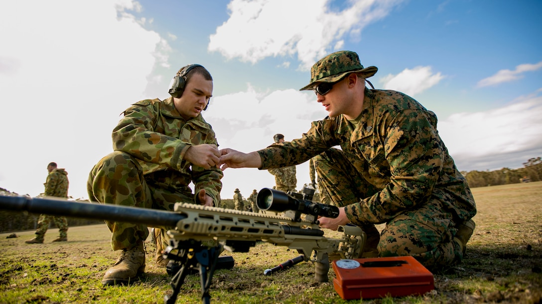 Sergeant Tanner Grace, a native of Troy, Pennsylvania, and an armorer for the Marine Corps Shooting Team, and Australian Army Pvt. Gareth Mulraney, an armorer for the Australian Army Skill at Arms Meeting 2015, work on the next-generation M40 sniper rifle during sniper rifle snap-in match May 10 at the Puckapunyal Military Area, Victoria, Australia, during the AASAM 2015. Grace was only international armorer supporting AASAM, an annual, international combat-marksmanship competition hosted by the Australian Army, May 6 to 22. During the competition, Grace and Mulraney were the only armorers working on other nation’s service pistols, rifles, sniper rifles and machine guns. The AASAM competition afforded an unprecedented combined training opportunity and improved interoperability with Australian Defense Forces and other militaries present at AASAM 2015.