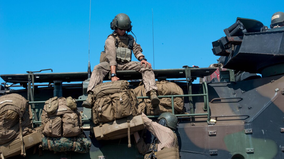 Marines with 3rd Assault Amphibian Battalion strap packs to an amphibious assault vehicle during Exercise Dawn Blitz at Marine Corps Base Camp Pendleton, California, Sept. 5, 2015. Dawn Blitz is a multinational training exercise being conducted by Expeditionary Strike Group Three and 1st Marine Expeditionary Brigade to build U.S., Japan, Mexico and New Zealand’s amphibious operations and command and control capabilities through live, simulated and constructive military training activities.
