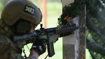 United States Army Staff Sergeant David Personius discharges his rifle during the live-fire stress-shoot portion of the second-annual Cascade Challenge, held at Schofield Barracks, Hawaii, Sept. 9. The Cascade Challenge lasted three days and pitted nine two-man teams in a competition to test their combat skills, knowledge, and abilities specific to the Tactical Air Control Party mission. (U.S. Air Force photo by Senior Airman Christopher Stoltz)