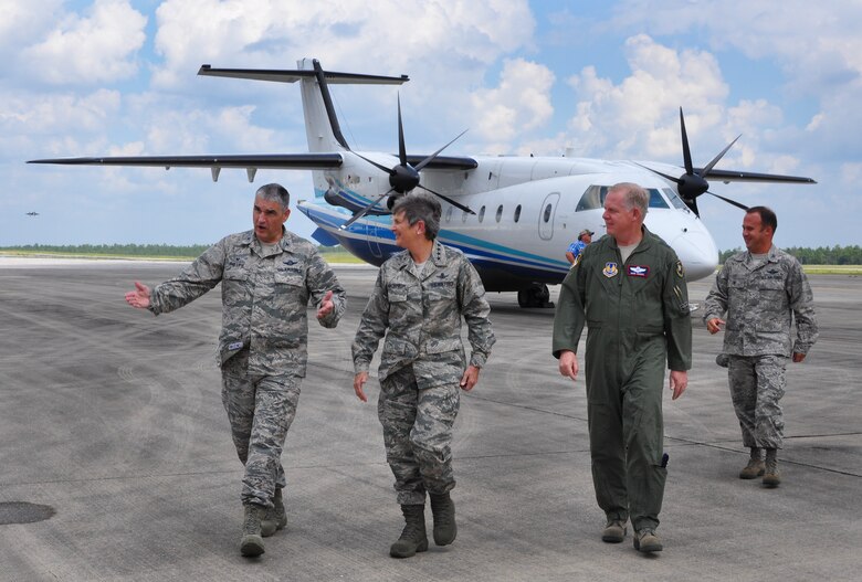 Col. James Phillips, 919th Special Operations Wing commander, welcomes Gen. Ellen M. Pawlikowski, Air Force Materiel Command commander, to Duke Field, Fla., Sept. 9. Pawlikowski visited the Reserve base with Maj. Gen. David Harris, the Air Force Test Center Commander (pictured), during her tour of Eglin Air Force Base. She also met with the wing's combat aviation advisers and flew in the special operations aircraft, C-146 Wolfhound.  (U.S. Air Force photo/Dan Neely)
