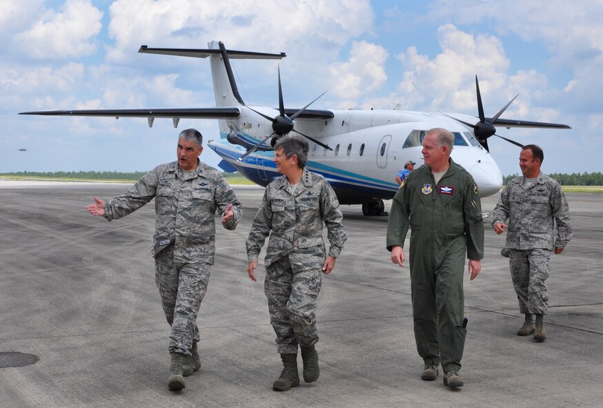 Col. James Phillips, 919th Special Operations Wing commander, welcomes Gen. Ellen M. Pawlikowski, Air Force Materiel Command commander, to Duke Field, Fla., Sept. 9. Pawlikowski visited the Reserve base with Maj. Gen. David Harris, the Air Force Test Center Commander (pictured), during her tour of Eglin Air Force Base. She also met with the wing's combat aviation advisers and flew in the special operations aircraft, C-146 Wolfhound.  (U.S. Air Force photo/Dan Neely)
