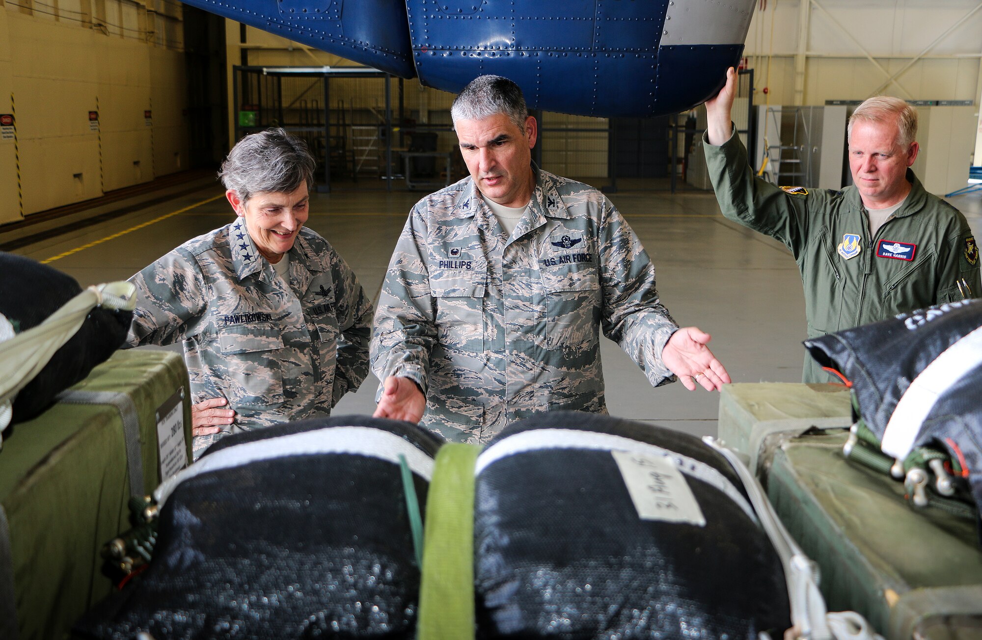 Col. James Phillips, 919th Special Operations Wing commander, talks with Gen. Ellen M. Pawlikowski, Air Force Materiel Command commander, about an aerial cargo delivery system at Duke Field, Fla., Sept. 9. Pawlikowski visited the Reserve base with Maj. Gen. David Harris, the Air Force Test Center Commander (pictured), during her tour of Eglin Air Force Base. She also met with the wing's combat aviation advisers and flew in the special
operations aircraft, C-146 Wolfhound.  (U.S. Air Force photo/Irene Freiberg)
