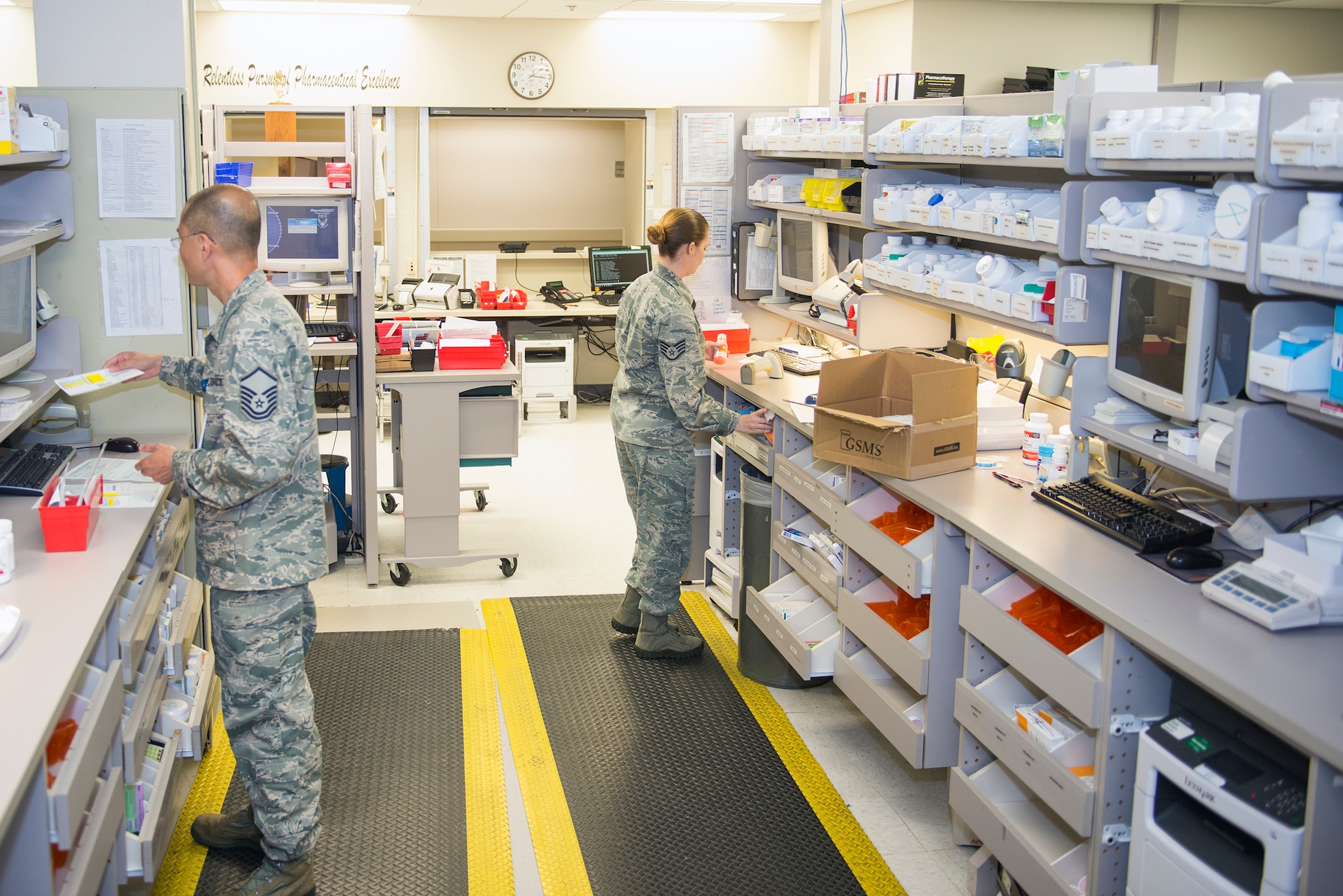Members of the 23d Medical Group pharmacy fill prescription medications Sept. 8, 2015, at Moody Air Force Base, Ga. The base pharmacy is responsible for accomodating all of Moody’s active-duty personnel, retirees, and their dependents. (U.S. Air Force photo by Airman 1st Class Greg Nash/Released)
