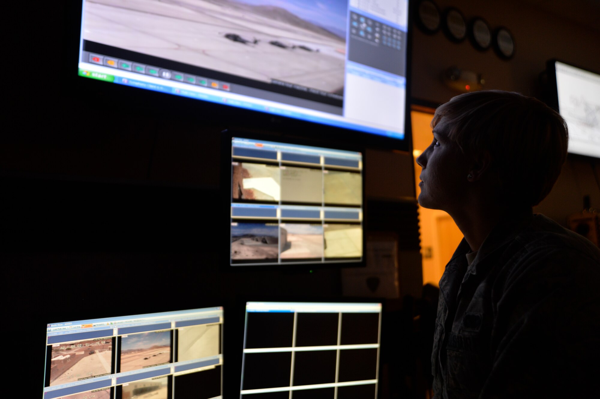 Airman 1st Class Deborah Clark, 799th Security Forces Squadron alarm monitor, checks base cameras for abnormal activities at the base defense operations center at Creech Air Force Base, Nevada, Sept. 2, 2015. The BDOC’s mission is to maintain positive security of the base, control the dispatch and alarm systems, and control entry procedures while also providing emergency 911 services to Creech and local authorities. (U.S. Air Force photo by Tech. Sgt. Nadine Barclay) 