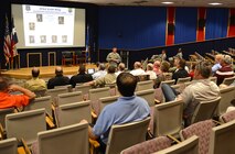 Col. William Whittenberger, Jr., 433rd Airlift Wing commander, gives a mission brief to civic leaders from Barksdale Air Force Base, Louisiana  Sept. 1, 2015 at Joint Base San Antonio-Lackland, Texas. The civics consisted of mayors, clergymen, and business leaders. The civic leader tour’s purpose is to strengthen the relationships between the private and government sectors and to share better business practices. (U.S. Air Force photo by Benjamin Faske) (released)