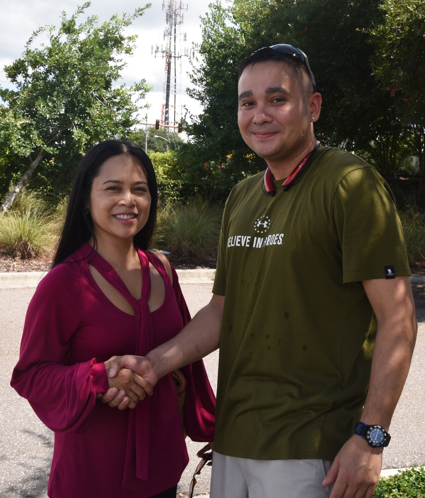 Tech. Sgt. Catherine Alcivar, Air Force Reservist assigned to MacDill AFB, Fla., thanks John Conner, local treasure finder, for finding a camera and pictures that were lost years ago. Conner searched for months to find Alcivar to return the lost images. He was able to find her due to a photo of her in uniform and contacting the MacDill AFB public affairs office. (U.S. Air Force photo by Staff Sgt. Adam C. Borgman)