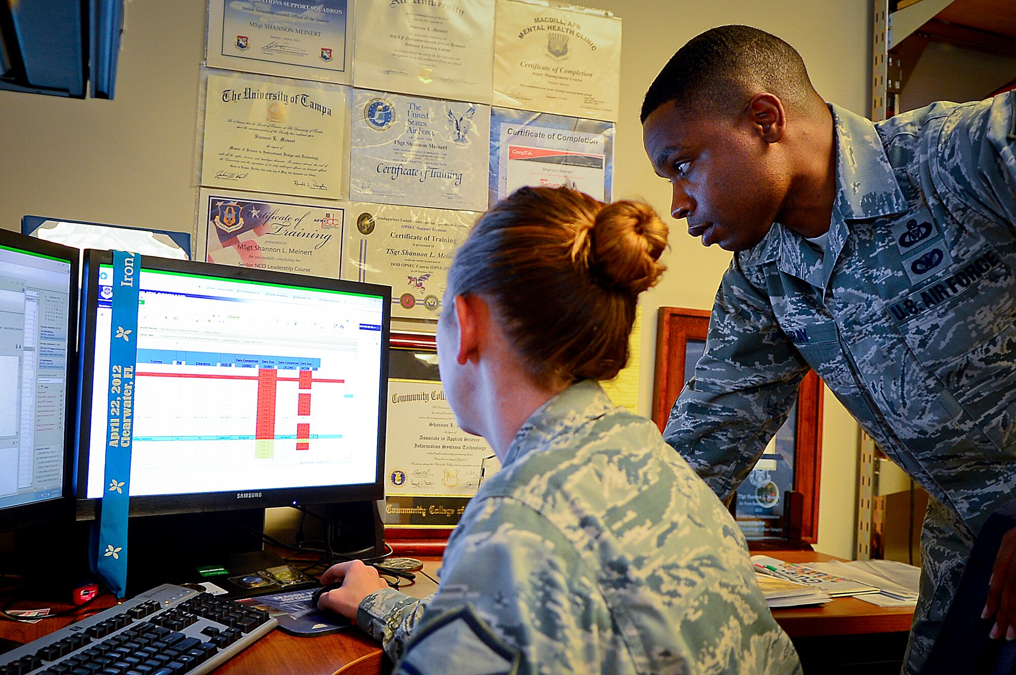 Master Sgt. Patrick Gray, 91st Air Refueling Squadron NCO in charge of aviation resource management, reviews aircrew communication requirements with Master Sgt. Shannon Meinert, 927th Operations Support Squadron combat crew communications, at MacDill Air Force Base, Fla., Sept. 3, 2105. Gray validates that aircrew members have met daily aircraft safety and physical requirements before authorizing them to proceed to their assigned aircraft. (U.S. Air Force photo by Senior Airman Ned T. Johnston/Released)