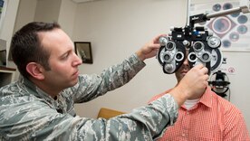 Maj. Peter Carra, 628th Medical Group Optometry flight commander, adjusts his ophthalmic equipment Sep. 9, 2015, at Joint Base Charleston – Air Base, S.C. The optometry clinic provides services such as eye examinations, visual acuity checks, repairing glasses, color vision tests and comprehensive exams. To set up an appointment, call the Air Base optometry clinic at 843-963-6880. (U.S. Air Force photo/Airman 1st Class Clayton Cupit)