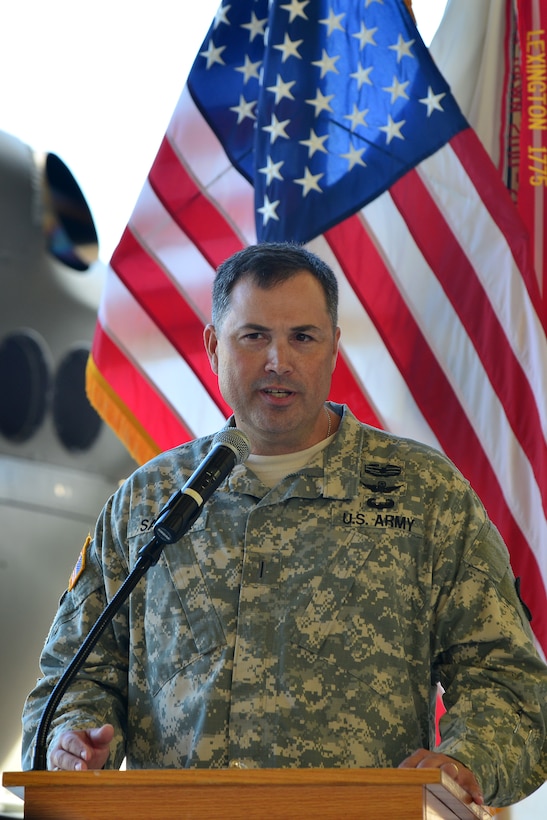 U.S. Army Chief Warrant Officer 5 Lynwood T. Saville, U.S. Army Training and Doctrine Command Flight Detachment commander, speaks during the TFD’s deactivation ceremony at Fort Eustis, Va., Sept. 8, 2015. The TFD provided transportation for TRADOC leadership while also supporting aviation students, parachute-drops, sling-loads, damage assessments, search and rescue, photo missions and aviation flight hours. (U.S. Air Force photo by Staff Sgt. Natasha Stannard/Released)