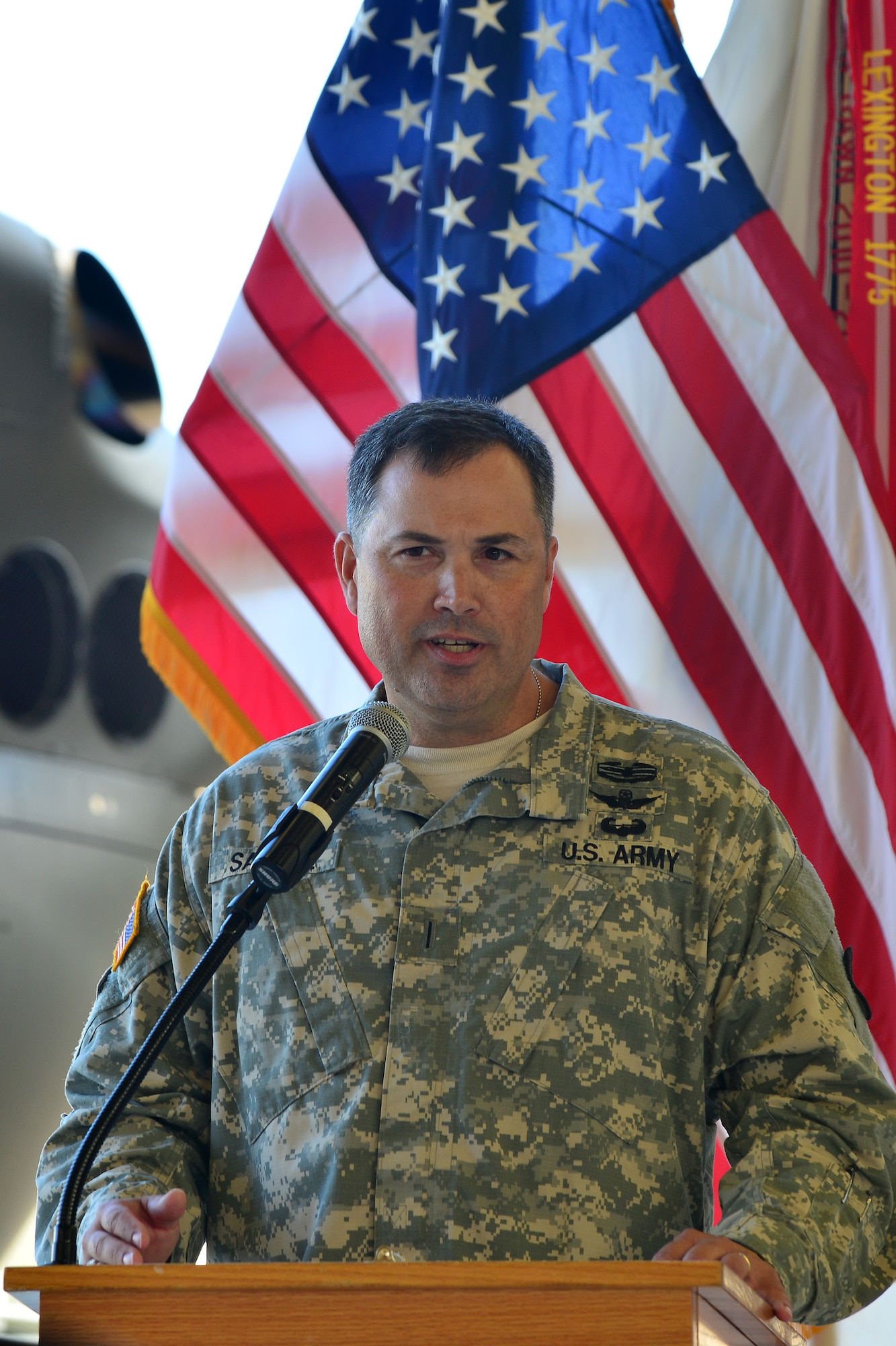 U.S. Army Chief Warrant Officer 5 Lynwood T. Saville, U.S. Army Training and Doctrine Command Flight Detachment commander, speaks during the TFD’s deactivation ceremony at Fort Eustis, Va., Sept. 8, 2015. The TFD provided transportation for TRADOC leadership while also supporting aviation students, parachute-drops, sling-loads, damage assessments, search and rescue, photo missions and aviation flight hours. (U.S. Air Force photo by Staff Sgt. Natasha Stannard/Released)