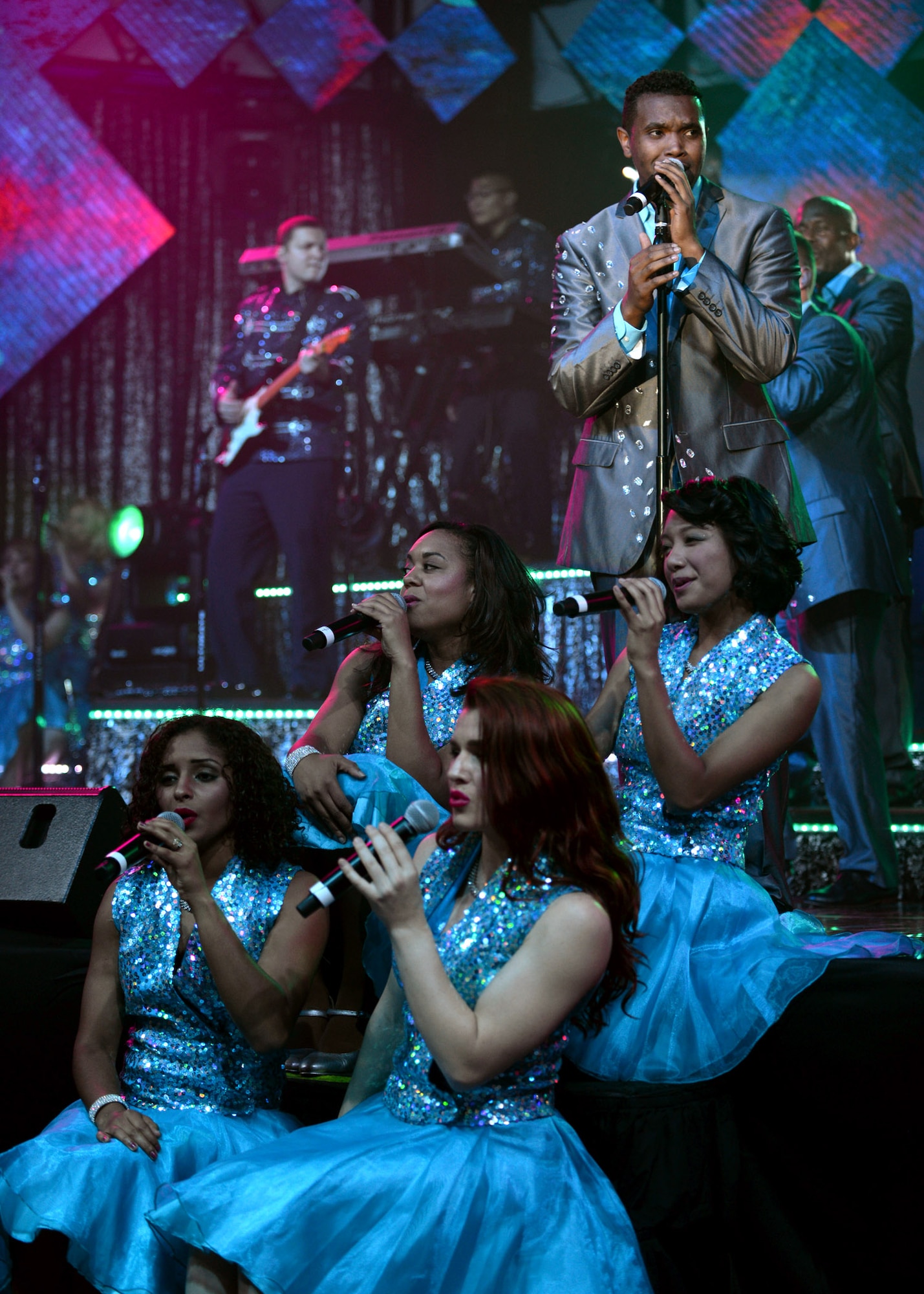 Members of Tops in Blue perform at the Northside Fitness Center Sept. 4, 2015, on RAF Mildenhall, England. Each year, Tops in Blue travels the globe performing for service members and their families to raise morale. (U.S. Air Force photo by Senior Airman Christine Halan/Released)