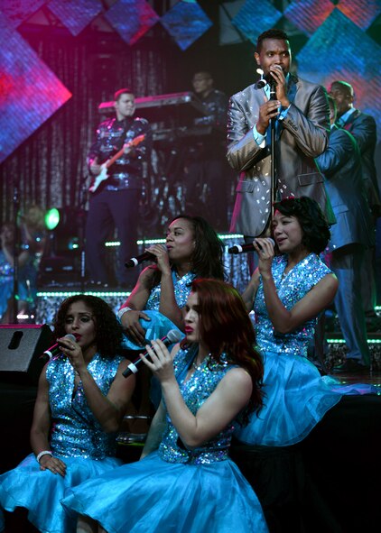 Members of Tops in Blue perform at the Northside Fitness Center Sept. 4, 2015, on RAF Mildenhall, England. Each year, Tops in Blue travels the globe performing for service members and their families to raise morale. (U.S. Air Force photo by Senior Airman Christine Halan/Released)