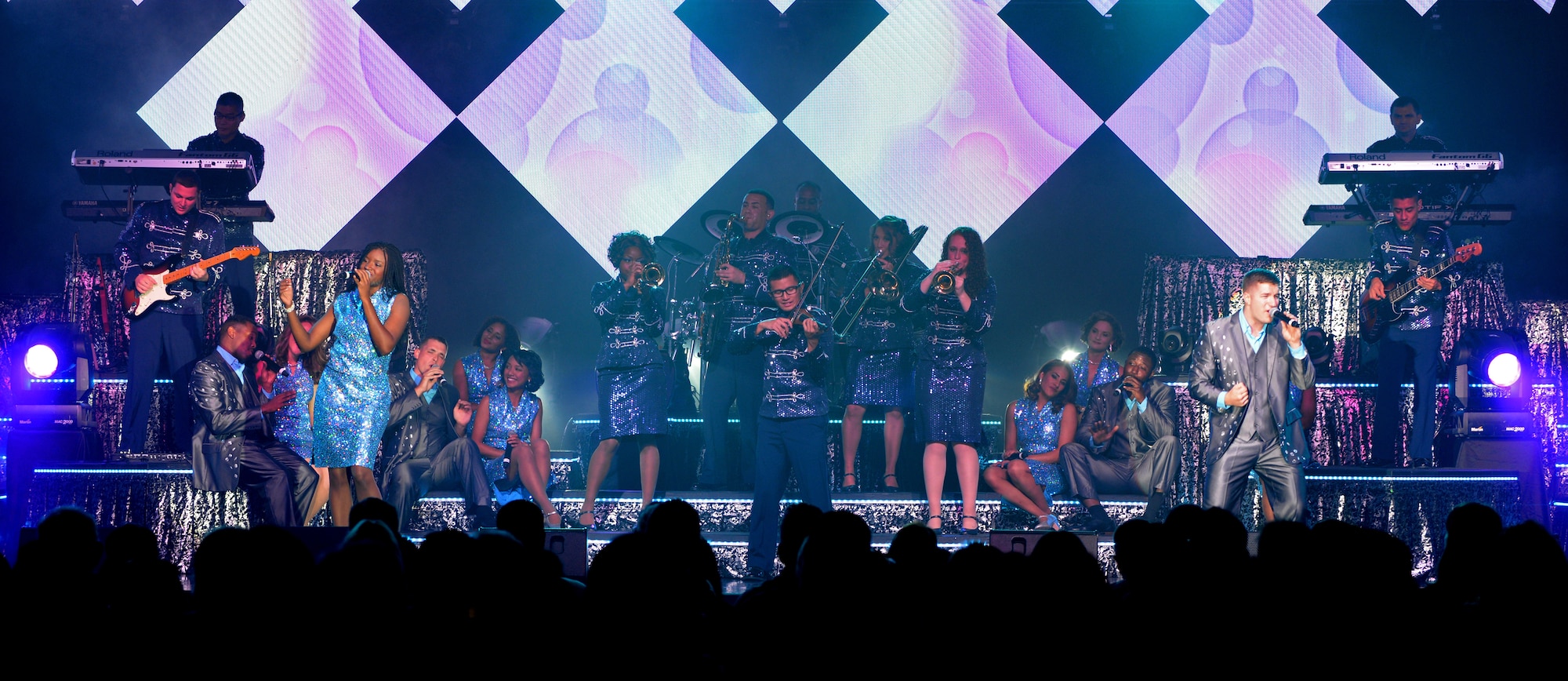 Members of Tops in Blue perform at the Northside Fitness Center Sept. 4, 2015, on RAF Mildenhall, England. The Tops in Blue crew consists of Airmen from different bases and career fields who travel to various bases to perform for service members and their families to raise morale. (U.S. Air Force photo by Senior Airman Christine Halan/Released)