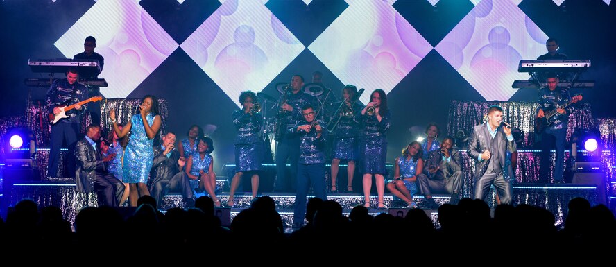 Members of Tops in Blue perform at the Northside Fitness Center Sept. 4, 2015, on RAF Mildenhall, England. The Tops in Blue crew consists of Airmen from different bases and career fields who travel to various bases to perform for service members and their families to raise morale. (U.S. Air Force photo by Senior Airman Christine Halan/Released)