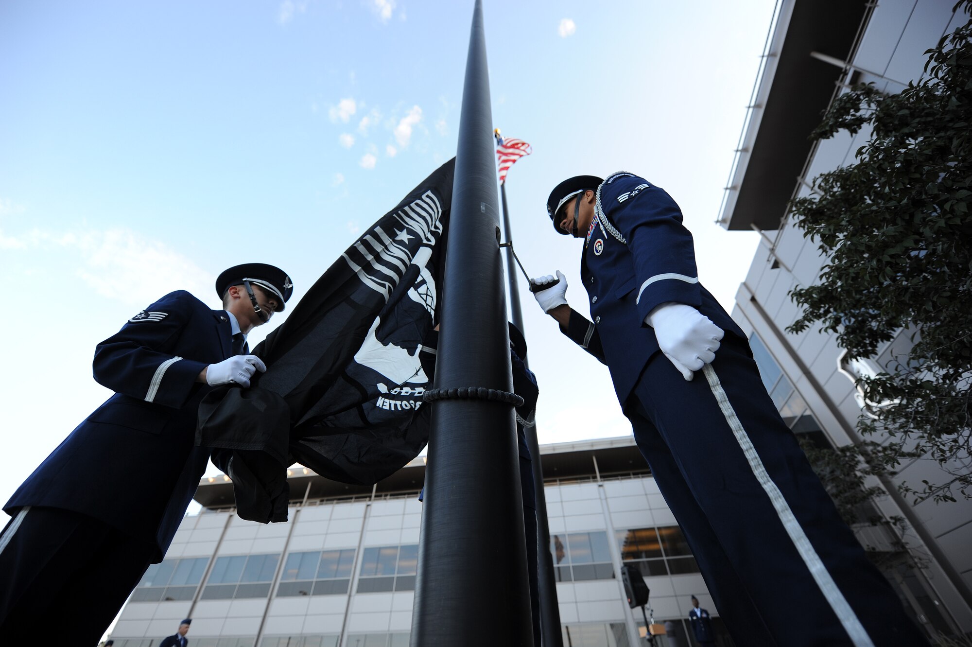 Honor guard members raise the POW/MIA flag in honor of POW/MIA week Sept. 9, 2013, at Schriever Air Force Base, Colorado. This year’s remembrance week will include opening and closing ceremonies featuring speakers, including wing leadership as well as retired U.S. Army Master Sgt. Ed Beck, a former prisoner of war. (U.S. Air Force Photo/Dennis Rogers)