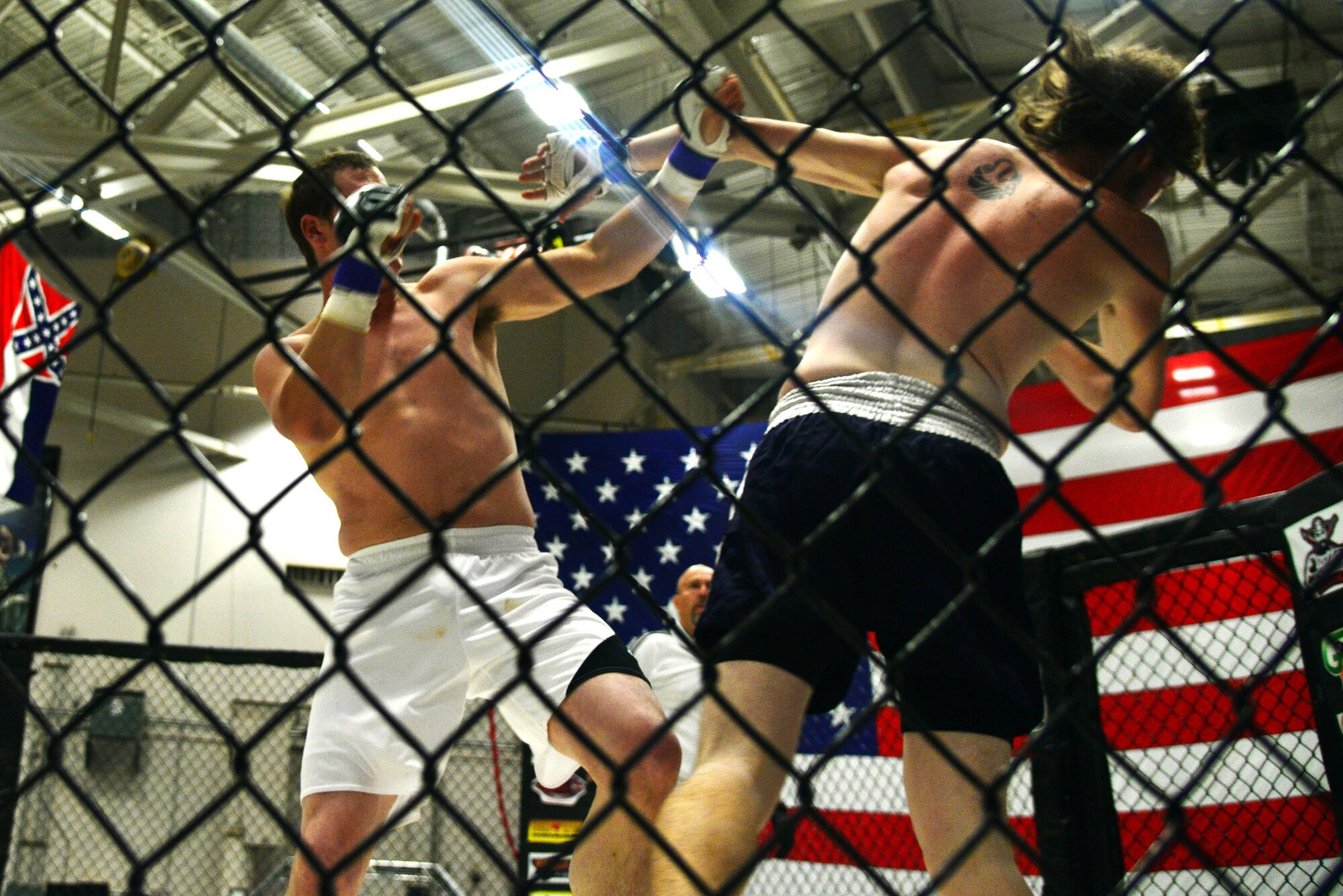 Mixed martial artists fight in front hundreds of Team Malmstrom members Aug. 4, 2015, at Malmstrom Air Force Base, Mont.  To kick off Labor Day weekend, the venue was free for all personnel with access to the base.  (U.S. Air Force photo/Airman Daniel Brosam)