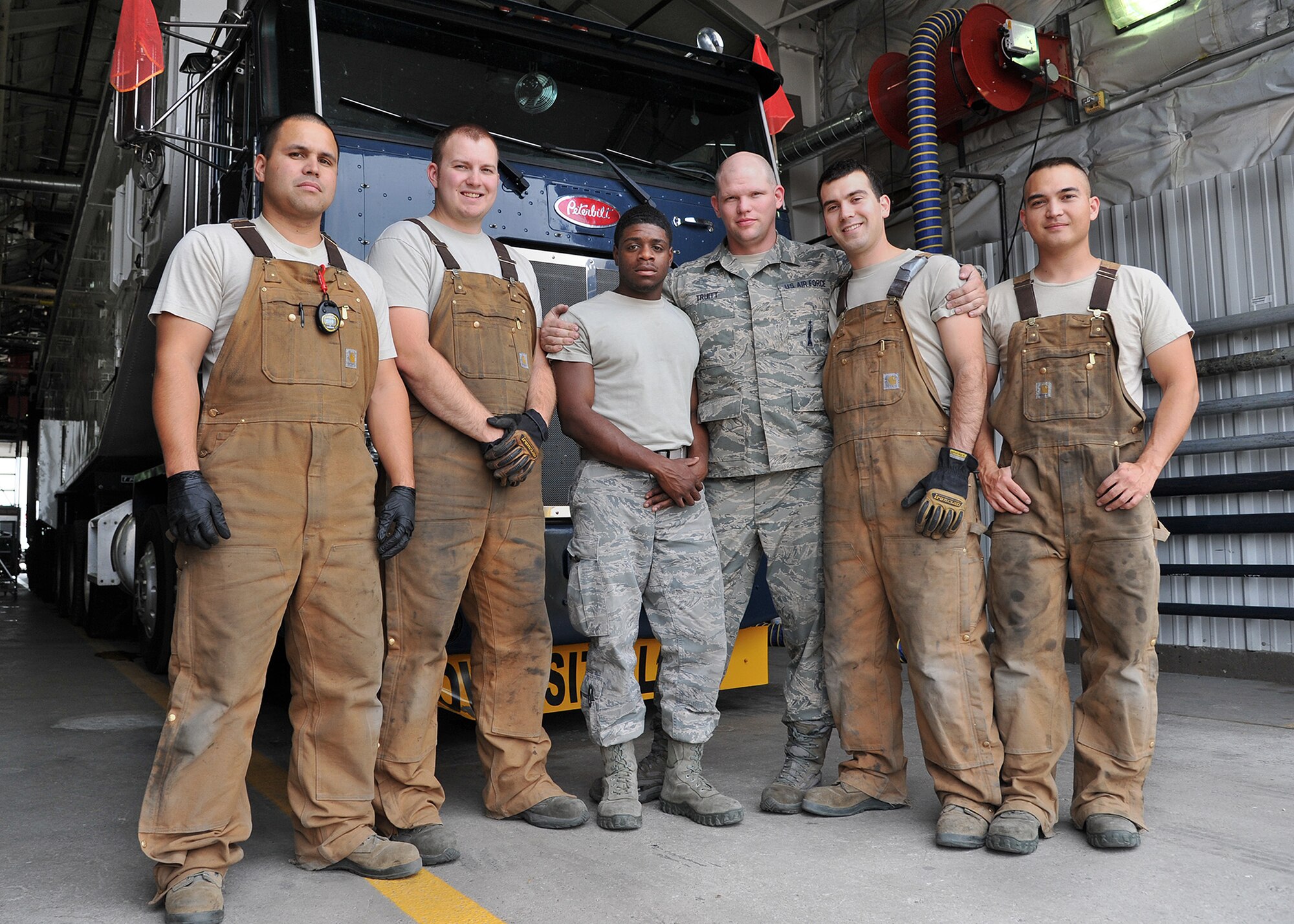 The 341st Maintenance Group’s Global Strike Challenge 2015 Missile Handling Team poses in front of a transporter-erector vehicle Sept. 2, 2015, at Malmstrom Air Force Base, Mont. Pictured from left to right are Tech. Sgt. Gary Pamplin, team chief; Senior Airman Brett Besserman, team member; Senior Airman Shaquille Stephens, alternate team member; Staff Sgt. Matthew Truitt, team trainer; Senior Airman Michael Beverly, team member; and Senior Airman Christopher Blessing, team member. Not pictured is Staff Sgt. Andrew Wellman, team trainer. The team competed Sept. 8-11 at Malmstrom. (U.S. Air Force photo/John Turner)