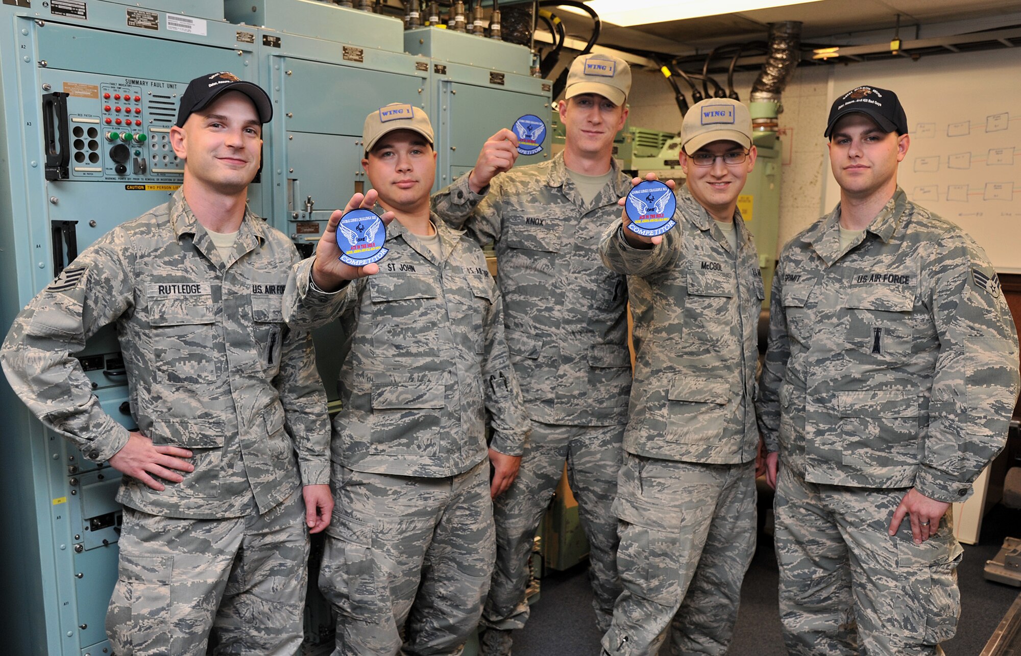 The 341st Maintenance Group’s Global Strike Challenge 2015 Missile Communications Team poses with wing competitor recognition patches Sept. 2, 2015, at Malmstrom Air Force Base, Mont. Pictured from left to right are Staff Sgt. Joshua Rutledge, team trainer; Senior Airman Chris St. John, alternate team member; Senior Airman Taylor Knox, team chief; Senior Airman Tripp McCool, team member; and Senior Airman Travis Grimit, team trainer. The team competed Sept. 8-11 at Malmstrom. (U.S. Air Force photo/John Turner)