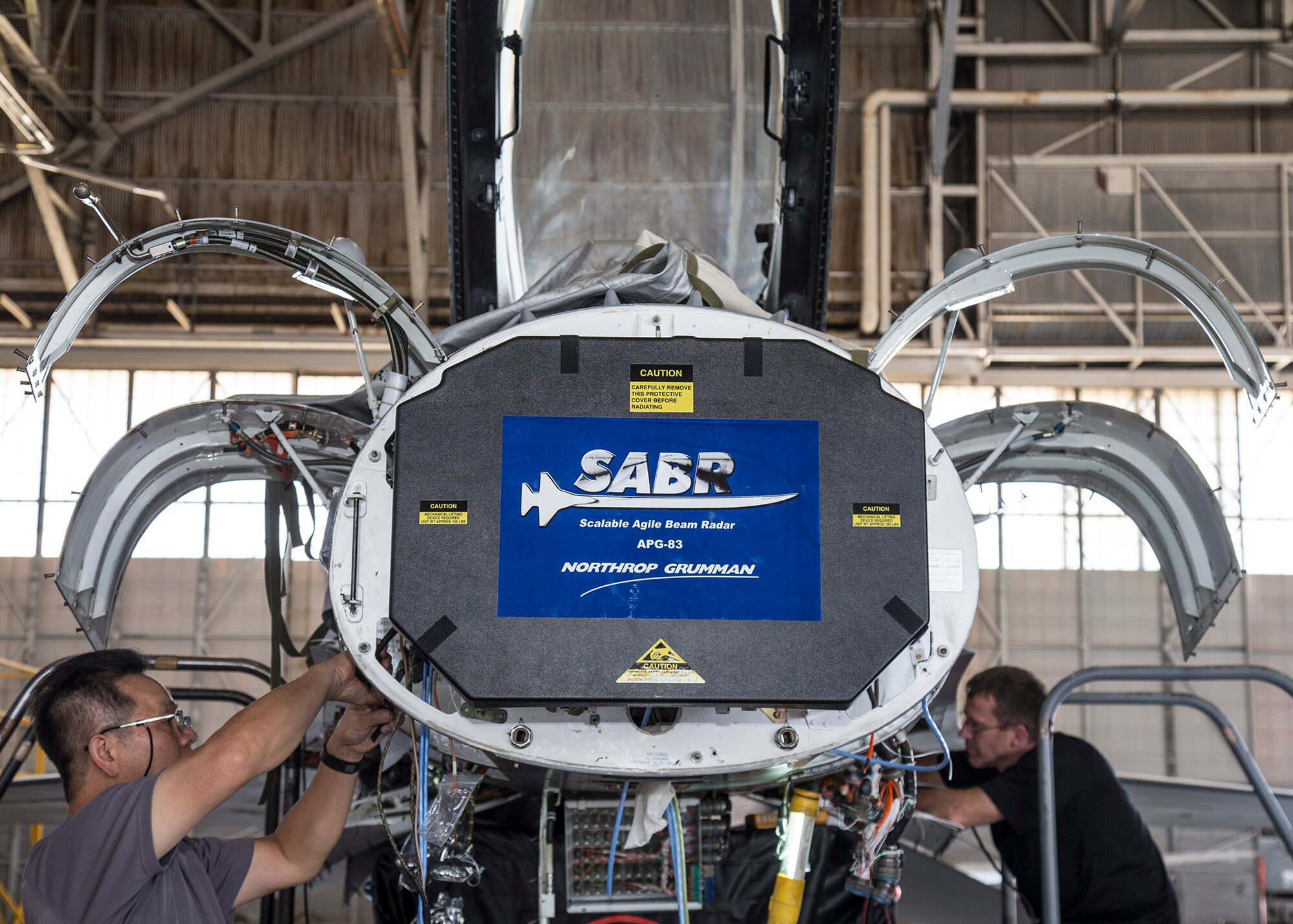As part of the F-16 Radar Modernization Program, a team from the 416th Flight Test Squadron are preparing to conduct flight testing of the Active Electronically Scanned Array (AESA) radar on two F-16s from Sept. 2015 through Aug. 2016. Current F-16 mechanically-scan radars have limited target handling capacity because existing mechanical scanning methods are inherently slow and require large amounts of power in order to respond rapidly enough to deal with large numbers of high-speed maneuvering targets. Additionally, Lockheed Martin Aeronautics selected Northrop Grumman to provide their Scalable Agile Beam Radar (SABR: AN/APG-83 Fire Control Radar) as contractor furnished equipment for Foreign Military Sales and potentially USAF F-16 modernization programs. (U.S. Air Force photo by Bobbi Zapka)