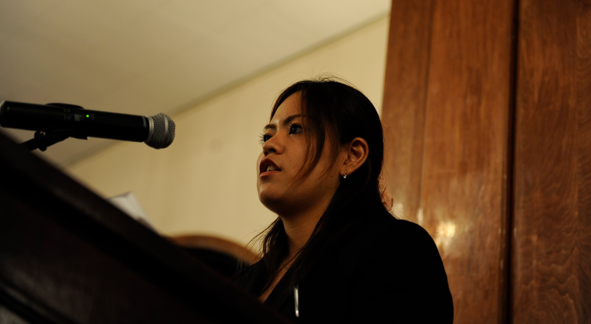 Airi Medoruma, a Kadena Language Institute intern at the Airman and Family Readiness Center, speaks to attendees of the 2015 KLI farewell dinner Sept. 3 on Kadena Air Base, Japan. She spoke of remembering her first phone call and experiencing difficulties understanding the customers. With the help of fellow staff members, she grew to enjoy the internship and wants to learn more about the English language. (U.S. Air Force photo by Airman 1st Class Lynette M. Rolen)