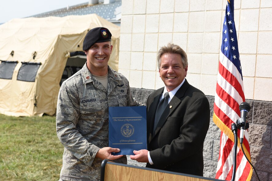 Pennsylvania State Representative Russ Diamond, right, presents Maj. Stephen McNamara, 148th Air Support Operations Squadron detachment commander, presents a certificate at a ribbon cutting ceremony and demonstration at Fort Indiantown Gap, Pennsylvania, Sept. 2, 2015. The ceremony highlighted the Pennsylvania National Guard’s 148th ASOS’s new Air National Guard Advanced Joint Terminal Attack Controller Training Simulator Building. The simulator helps Airmen develop the solid fundamentals necessary to become tomorrow’s Battlefield Airmen and keep their present Joint Terminal Attack Controllers current in their air control requirements.

The simulator is also a joint readiness tool for their Army National Guard counterparts. Together, they will now be able to conduct more realistic Joint fires Observer training; allowing qualified enlisted and junior officers to conduct Calls for Fire in a complex battlespace. They can also train joint forces in MedEvac 9-lines and emergency close air support which will aid in the capability development for their aligned Army units.   

This simulator is truly a force multiplier for both the Pennsylvania Army and Air National Guard. (U.S. Air National Guard photo by Master Sgt. Culeen Shaffer/Released)