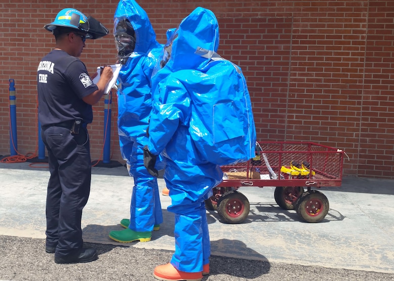 Members of the 162nd Wing Bioenvironmental Engineering team prepare to enter the incident area during the full-scale exercise portion of the Counter-CBRN All-Hazard Management Response (CAMR) course held here August 24- 27.