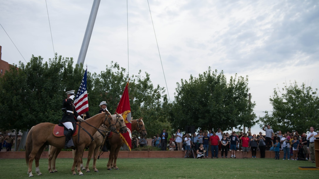 A Marine Corps mounted color guard present the colors at Civic Space Park, Phoenix, Sept. 9, 2015, as part of the opening ceremony for Marine Week Phoenix. Marine Week Phoenix allows the local community to see the Marine Corps in a way that they would not normally be able to experience.