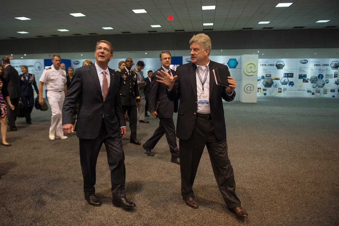 Steven H. Walker, right, Deputy Director, Defense Advanced Research Projects Agency walks with Defense Secretary Ash Carter through various exhibits and demonstrations on display at DARPA's “Wait, What?" future technology forum at the America's Convention Center Complex in St. Louis, Mo., Sept. 9, 2015. DoD photo by U.S. Air Force Senior Master Sgt. Adrian Cadiz
