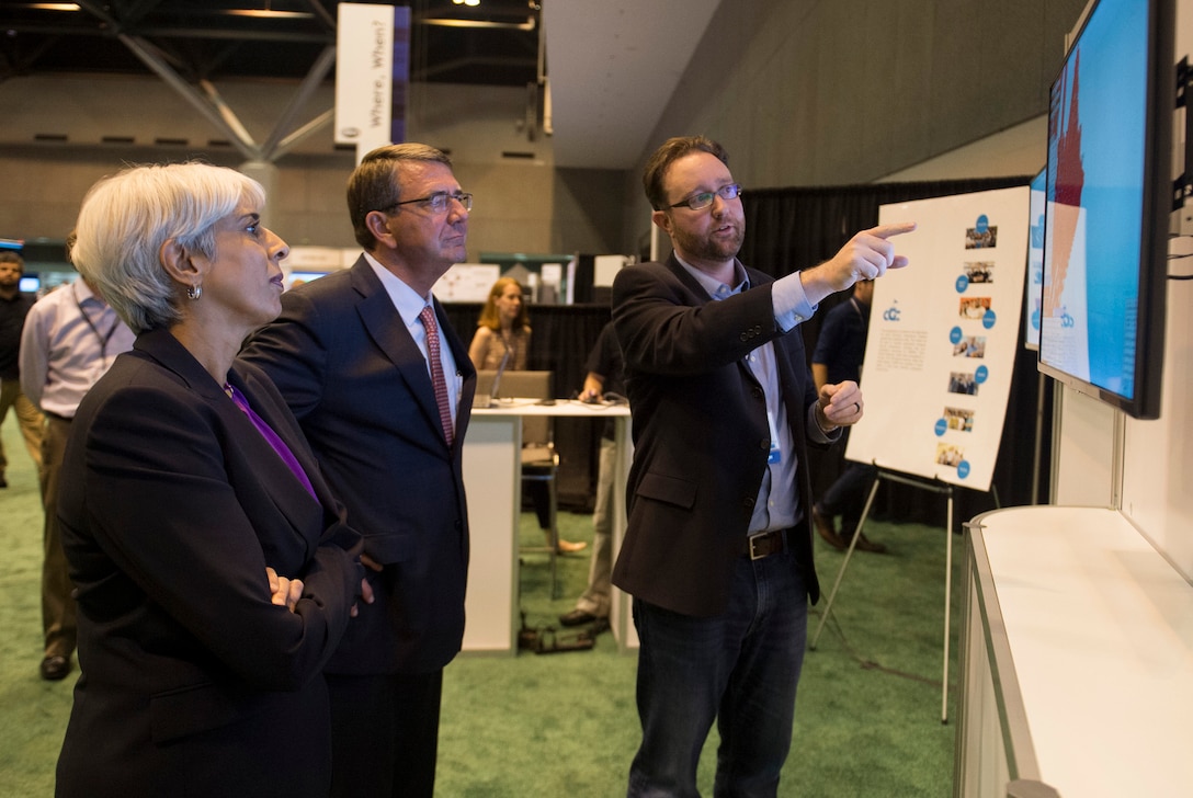 Defense Secretary Ash Carter is briefed on one of the displays at the Defense Advanced Research Projects Agency “Wait, What?" future technology forum at the America's Convention Center Complex in St. Louis, Mo., Sept. 9, 2015. DoD photo by U.S. Air Force Senior Master Sgt. Adrian Cadiz