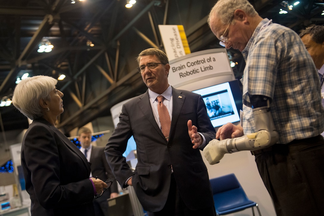 Defense Secretary Ash Carter speaks with Arati Prabhakar, Director of the Defense Advanced Research Projects Agency, as they view the robotic limb exhibit and demonstration at DARPA's “Wait, What?" future technology forum at the America's Convention Center Complex in St. Louis, Mo., Sept. 9, 2015. DoD photo by U.S. Air Force Senior Master Sgt. Adrian Cadiz