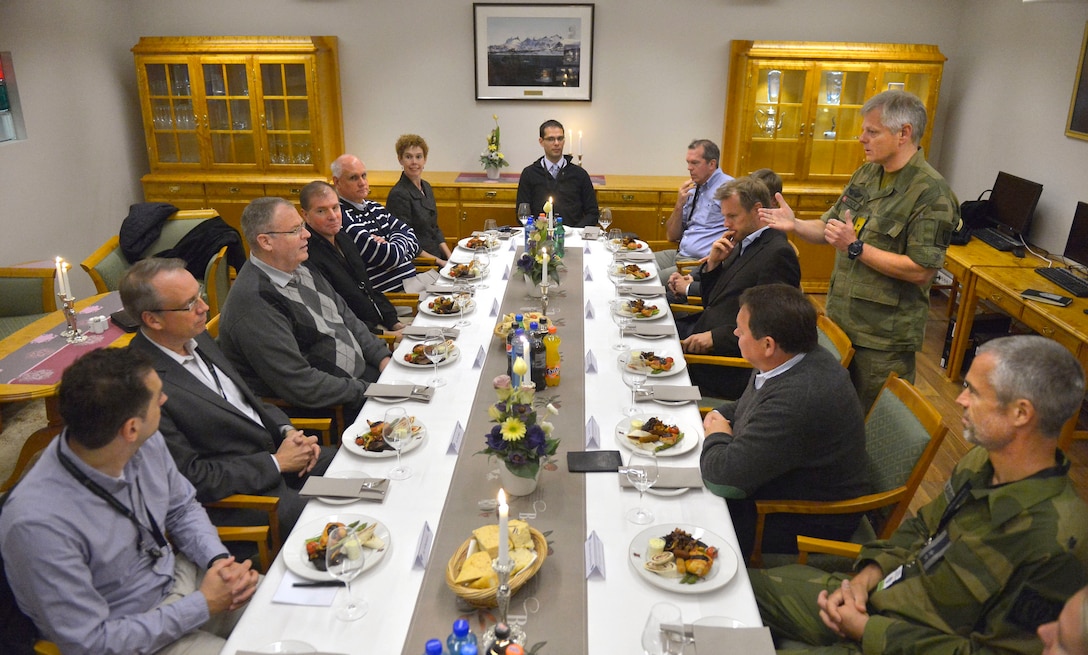 U.S. Deputy Defense Secretary Bob Work, left center, and his staff are offered lunch at Norwegian Joint Headquarters by Lt. Gen. Morten Haga Lunde, standing right, and Norwegian Secretary of State Oystein Bo, in Bodo, Norway, Sept. 9, 2015. DoD photo by Glenn Fawcett 