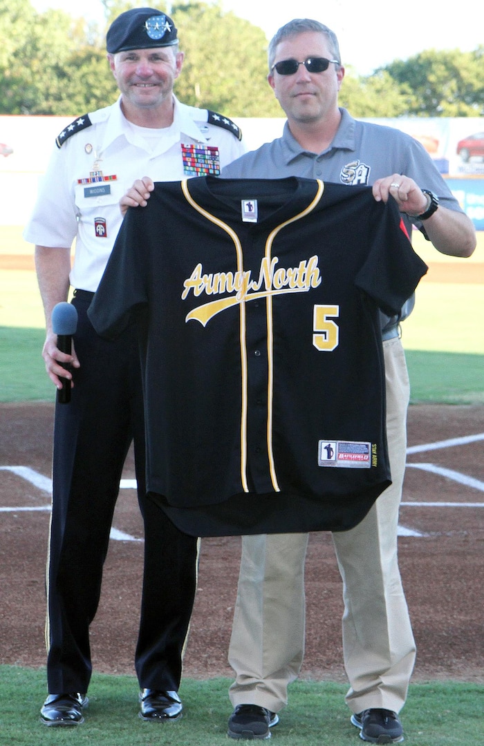 Lt. Gen. Perry Wiggins presents San Antonio Missions general manager Dave Gasaway with an Army North baseball jersey at the team’s Military Appreciation Night at Nelson Wolff Stadium in San Antonio Sept. 2. Wiggins is the commanding general of U.S. Army North (Fifth Army) and senior Army commander of Fort Sam Houston and Camp Bullis. The Missions are the Double-A minor-league affiliate of the San Diego Padres Major League Baseball team and play in the Texas League.