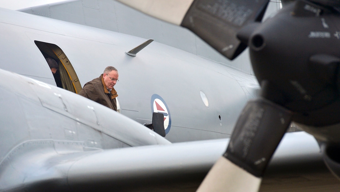 Deputy Defense Secretary Bob Work disembarks from a Norwegian P3-C maritime patrol aircraft after joining Norwegian Secretary of State Oystein Bo on a flight to observe patrol operations off the coast of Bodo, Norway, Sept. 9, 2015. DoD photo by Glenn Fawcett 