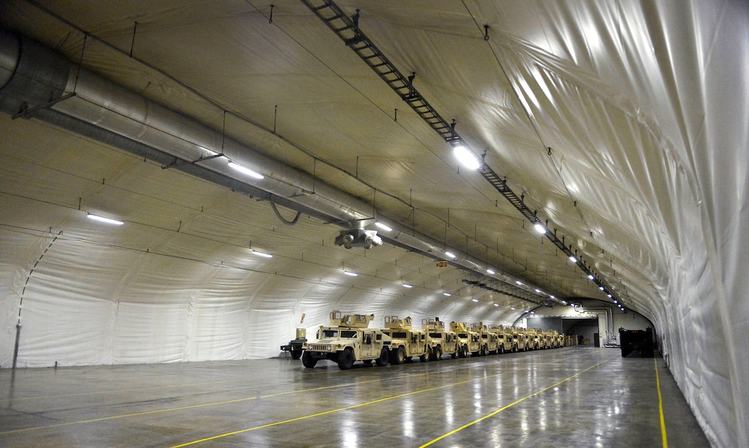 Neatly parked and carefully maintained military vehicles sit at the ready at the underground U.S. Marine Corps Prepositioning Program-Norway, near Trondheim, Norway, Sept. 9, 2015. DoD photo by Glenn Fawcett