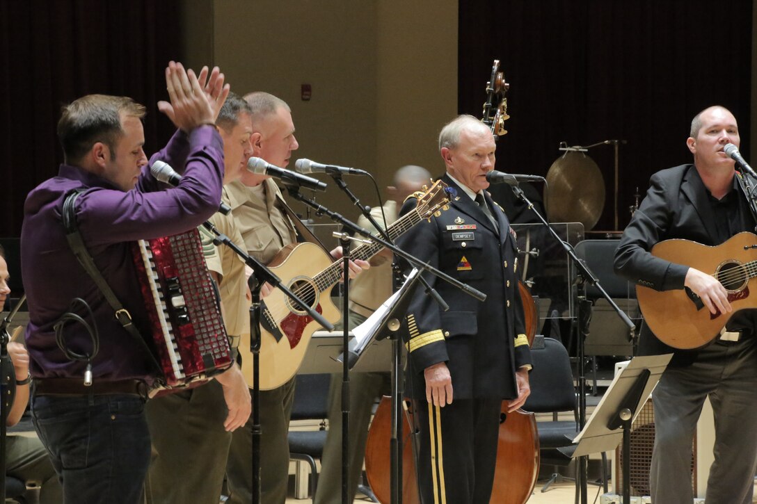 On Sept. 8, 2015, Chairman of the Joint Chiefs Gen. Martin Dempsey and the Irish folk-group the High Kings joined the Marine Band's Irish ensemble for a jam session in the John Philip Sousa Band Hall at the Marine Barracks Annex in Washington, D.C. The visit also included a tour of the building, led by Marine Band Director Lt. Col. Jason Fettig. (U.S. Marine Corps photo by Master Sgt. Kristin duBois/released)