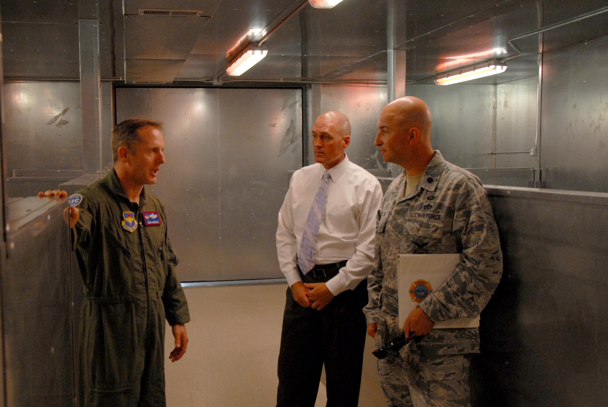 U.S. Air Force Brig. Gen. John A. Cherrey, Air Education and Training Command Intelligence, Operations and Nuclear Integration Director, talks with Lt. Col. Matthew D. Welling, 312th Training Squadron Commander, at the Louis F. Garland Department of Defense Fire Academy search and rescue trainer, Goodfellow Air Force Base, Texas, Sept. 9, 2015. Brig. Gen. Cherrey also visited the 315th Training Squadron and 316th Training Squadron to understand the training at Goodfellow. (U.S. Air Force photo by Senior Airman Joshua Edwards/Released)