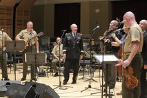 On Sept. 8, 2015, Chairman of the Joint Chiefs Gen. Martin Dempsey and the Irish folk-group the High Kings joined the Marine Band's Irish ensemble for a jam session in the John Philip Sousa Band Hall at the Marine Barracks Annex in Washington, D.C. The visit also included a tour of the building, led by Marine Band Director Lt. Col. Jason Fettig. (U.S. Marine Corps photo by Master Sgt. Kristin duBois/released)