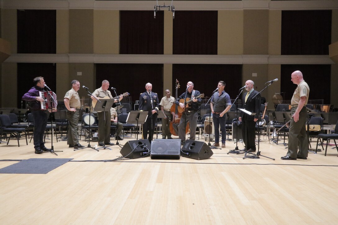 On Sept. 8, 2015, Chairman of the Joint Chiefs Gen. Martin Dempsey and the Irish folk-group the High Kings joined the Marine Band's Irish ensemble for a jam session in the John Philip Sousa Band Hall at the Marine Barracks Annex in Washington, D.C. The visit also included a tour of the building, led by Marine Band Director Lt. Col. Jason Fettig. (U.S. Marine Corps photo by Master Sgt. Kristin duBois/released)