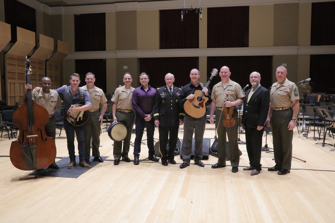 On Sept. 8, 2015, Chairman of the Joint Chiefs Gen. Martin Dempsey and the Irish folk-group the High Kings joined the Marine Band's Irish ensemble for a jam session in the John Philip Sousa Band Hall at the Marine Barracks Annex in Washington, D.C. The visit also included a tour of the building, led by Marine Band Director Lt. Col. Jason Fettig. (U.S. Marine Corps photo by Master Sgt. Kristin duBois/released)
