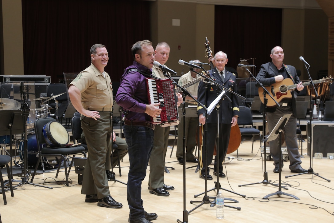 On Sept. 8, 2015, Chairman of the Joint Chiefs Gen. Martin Dempsey and the Irish folk-group the High Kings joined the Marine Band's Irish ensemble for a jam session in the John Philip Sousa Band Hall at the Marine Barracks Annex in Washington, D.C. The visit also included a tour of the building, led by Marine Band Director Lt. Col. Jason Fettig. (U.S. Marine Corps photo by Master Sgt. Kristin duBois/released)