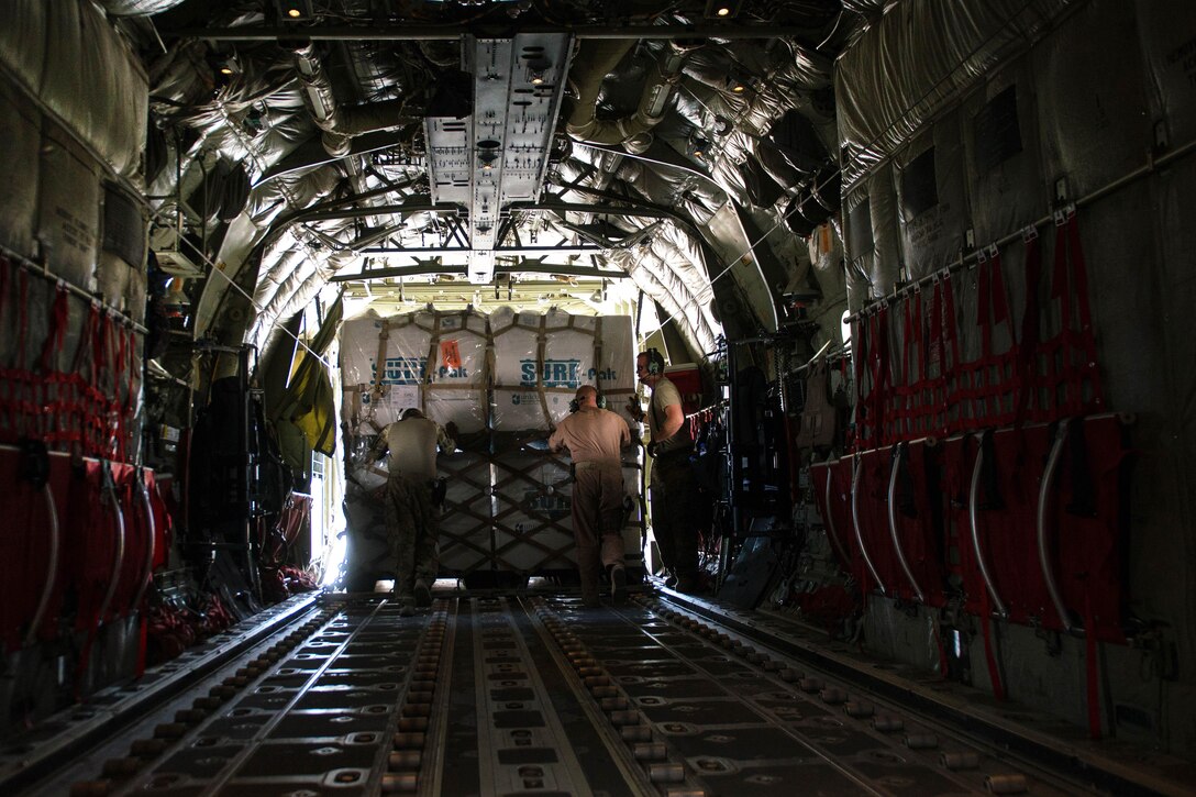 U.S. airmen unload cargo from an Air Force C-130J Super Hercules aircraft on Camp Dwyer, Afghanistan, Aug. 27, 2015. The airmen are assigned to the 455th Air Expeditionary Wing. The aircraft's short takeoff and landing capability makes it an optimum fit for Afghanistan’s rugged terrain. U.S. Air Force photo by Tech. Sgt. Joseph Swafford