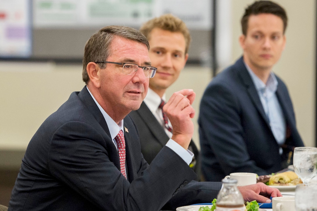 Defense Secretary Ash Carter speaks with a group of Defense Advanced Research Projects Agency rising stars while attending the Defense Advanced Research Agency’s “Wait, What?" future technology forum in St. Louis, Mo., Sept. 9, 2015.  