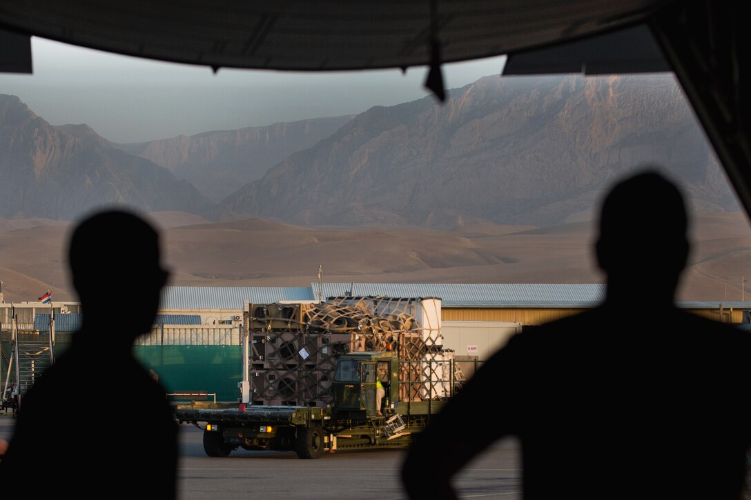 U.S. airmen prepare to load cargo onto an Air Force C-130J Super Hercules aircraft at Mazar-e Sharif Airfield, Afghanistan, Aug. 27, 2015. U.S. Air Force photo by Tech. Sgt. Joseph Swafford