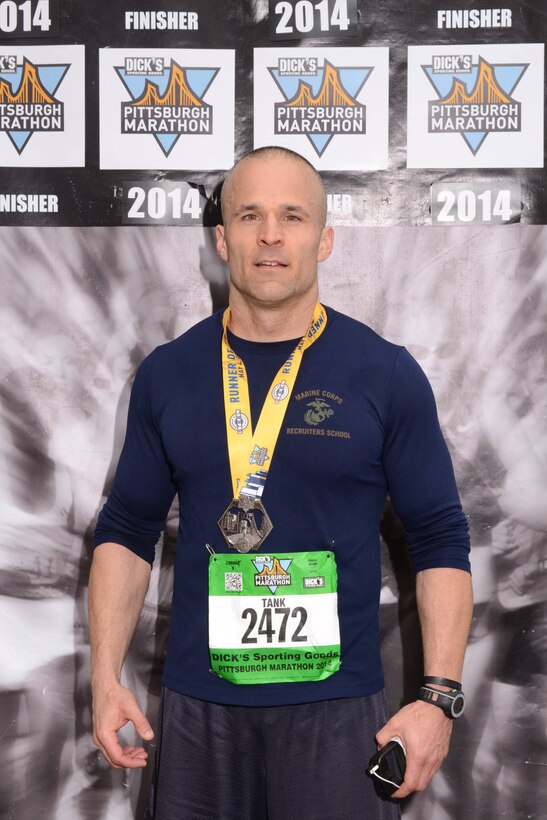 Gunnery Sgt. Eugene R. Bryant poses for a photo after completing the Pittsburgh Marathon in Pittsburgh on May 3, 2014. The Pittsburgh Marathon is the last marathon Bryant has completed and now, his next goal is to run a 100 mile-charity race. 
