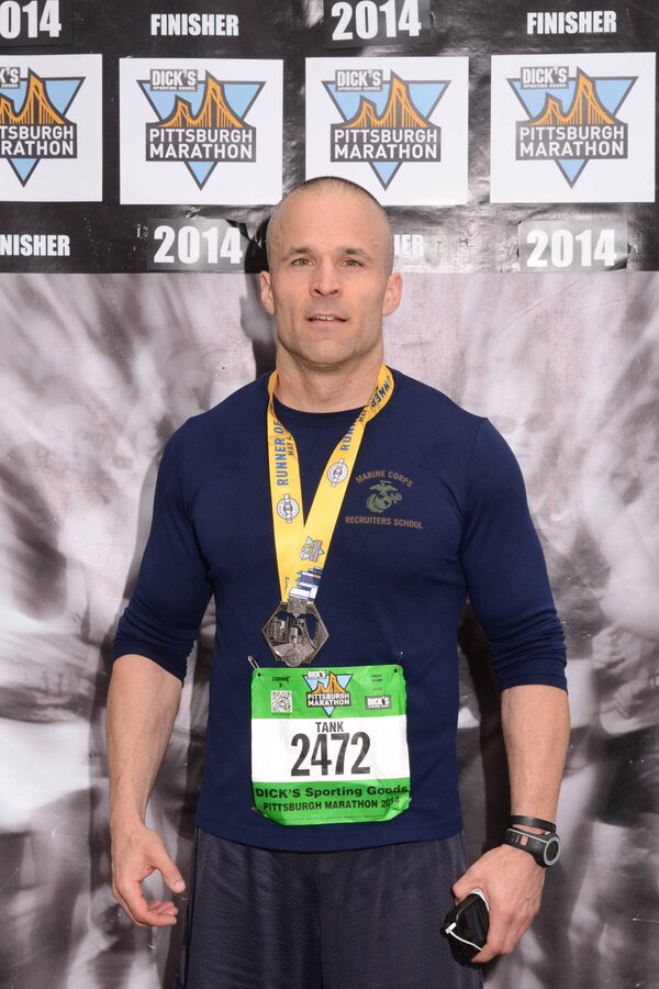 Gunnery Sgt. Eugene R. Bryant poses for a photo after completing the Pittsburgh Marathon in Pittsburgh on May 3, 2014. The Pittsburgh Marathon is the last marathon Bryant has completed and now, his next goal is to run a 100 mile-charity race. 