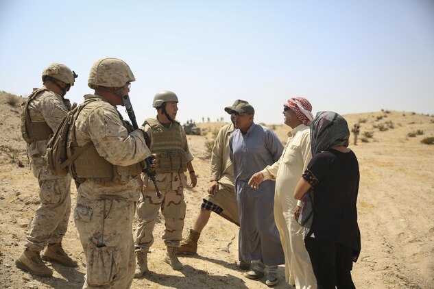 Marines with Combat Logistics Battalion 1, Combat Logistics Regiment 1 used a translator to communicate with role-players during Large Scale Exercise 15 aboard Marine Corps Air Ground Combat Center Twentynine Palms, Calif., Aug. 18, 2015. LSE-15 is a combined U.S. Marine Corps, Canadian and British exercise conducted at the brigade level, designed to enable live, virtual and constructive training for participating forces.