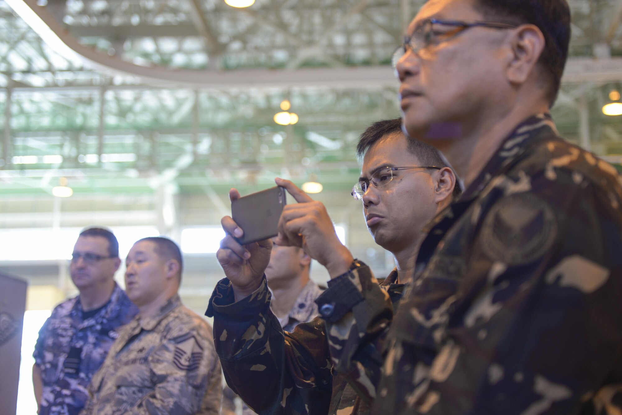 Participants of the 2015 Pacific Agility C-130 Logistics and Safety Symposium watch a capabilities demonstration at Yokota Air Base, Japan, Sept. 2. 2015. The process was used to highlight the effectiveness of implementing a standardized process among partner nations. (U.S. Air Force photo by Staff Sgt. Cody H. Ramirez/Released)