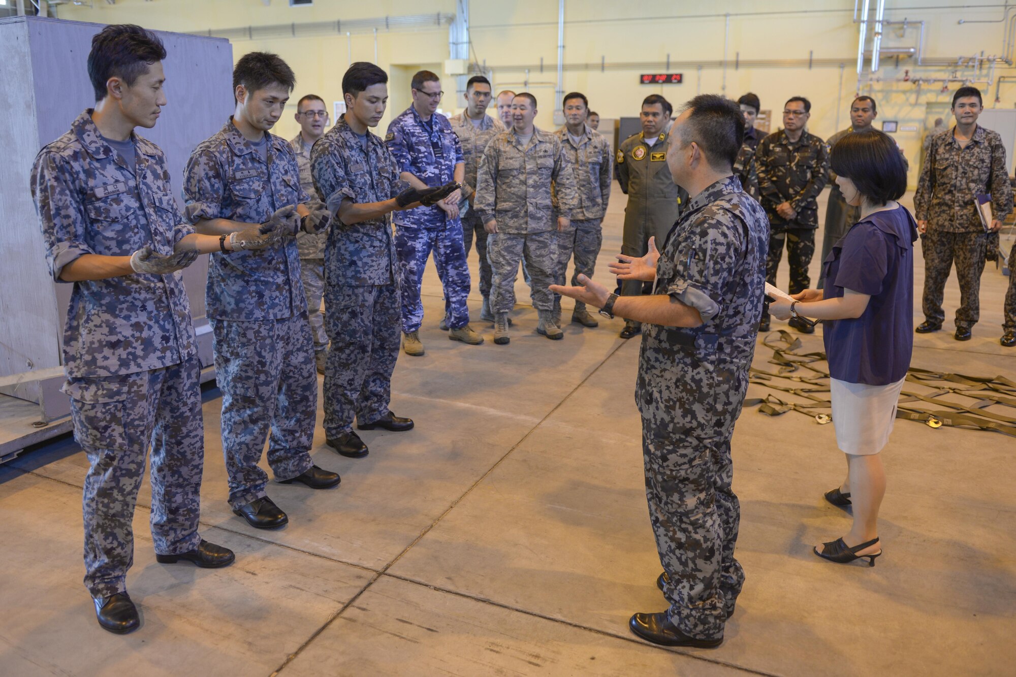 Members of the Japan Air Self-Defense Force prepare to rig a cargo load during the 2015 Pacific Agility Logistics and Safety Symposium at Yokota Air Base, Japan, Sept. 2, 2015. The load was later processed through a U.S. cargo facility, showcasing interoperability and standardization processes. (U.S. Air Force photo by Staff Sgt. Cody H. Ramirez/Released)
