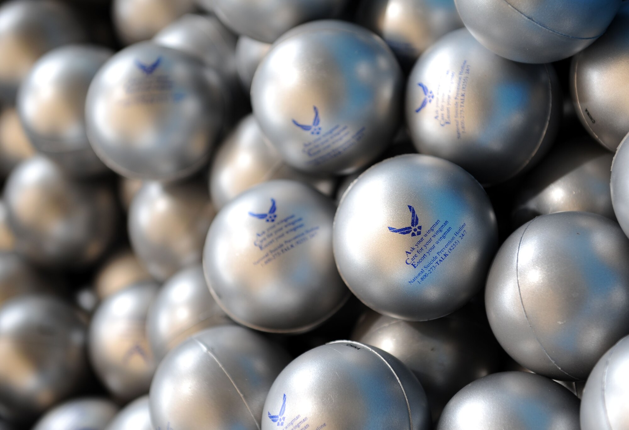 Suicide prevention stress balls are gathered in a bin to be handed out by 81st Medical Operations Squadron mental health technicians to Keesler personnel as they enter the base Sept. 10, 2015, Keesler Air Force Base, Miss. Today is World Suicide Prevention Day and Keesler will be raising awareness for suicide prevention throughout September.  (U.S. Air Force photo by Kemberly Groue)